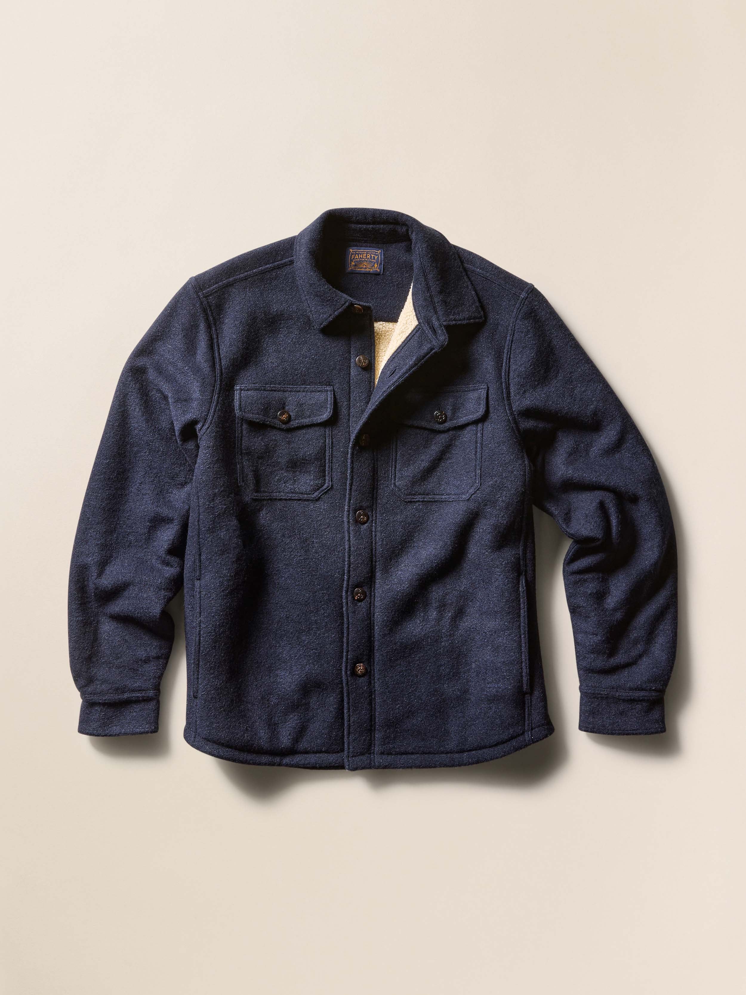 Navy blue jacket on a beige background
