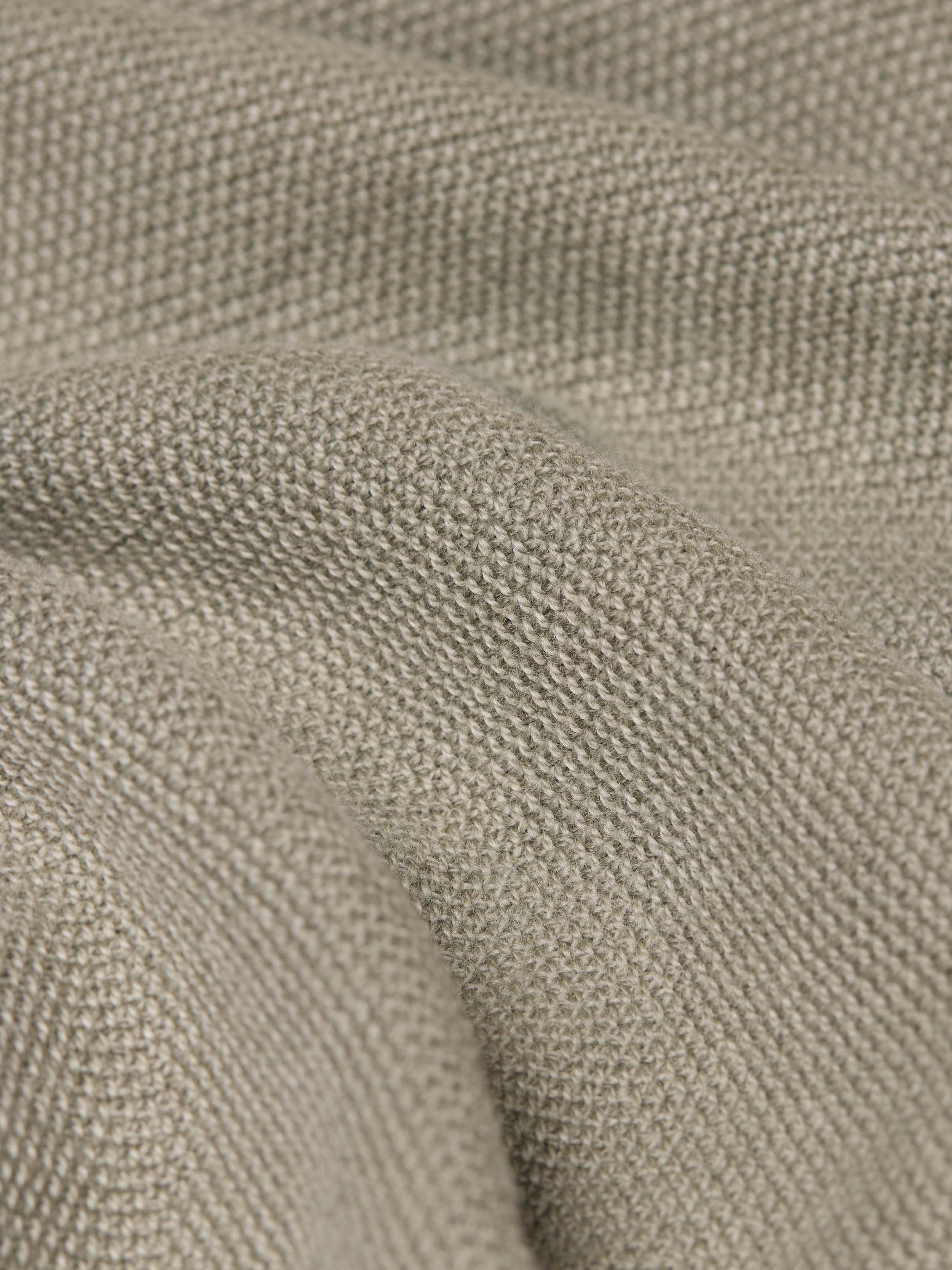 Close-up of textured sage green fabric