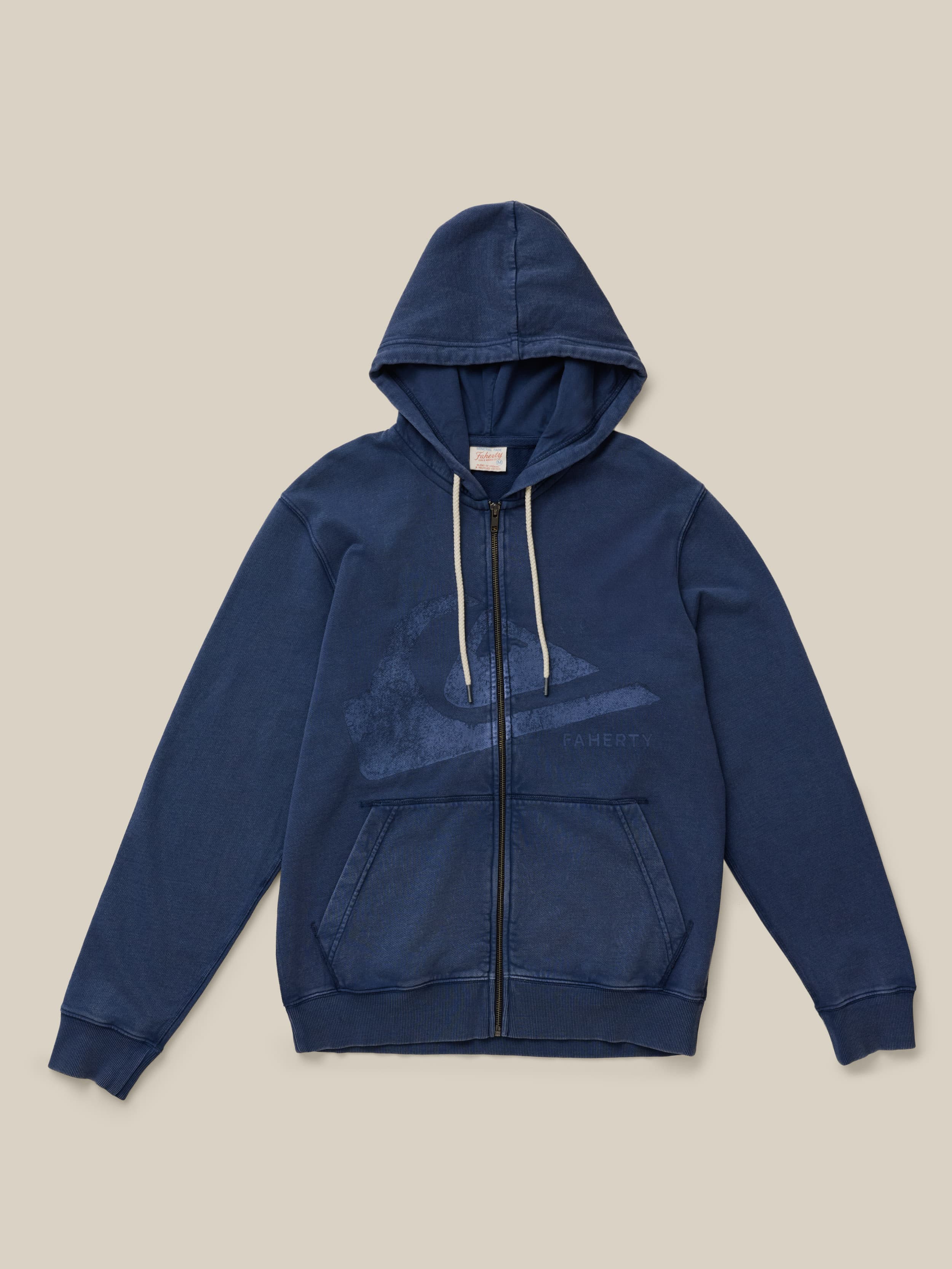 Blue zip up hoodie with Faherty x Quiksilver graphic on the center chest