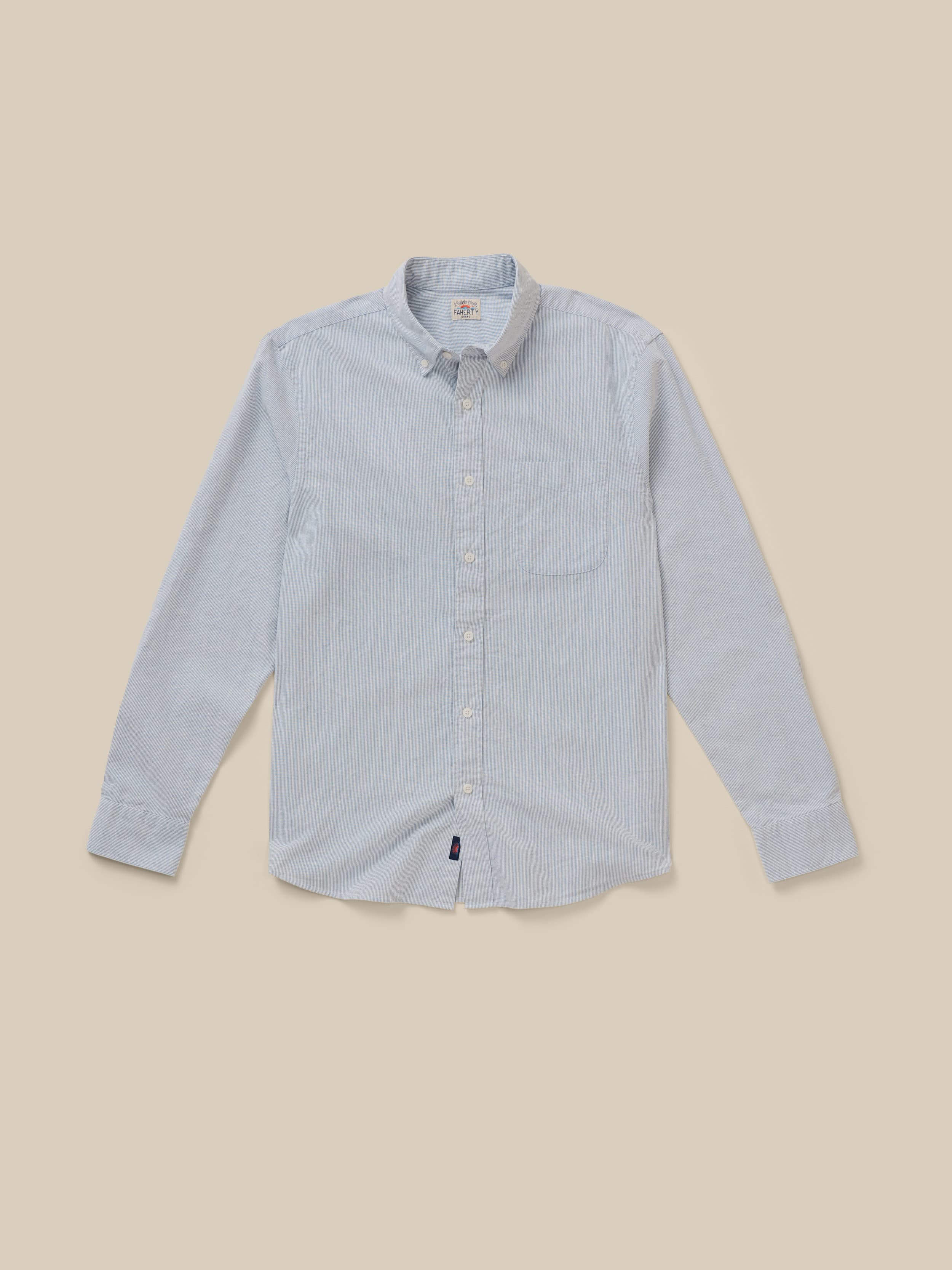 Light blue striped shirt on a beige background
